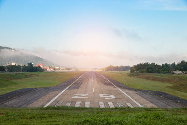 istock Airport runway with mountain in countryside 679891844