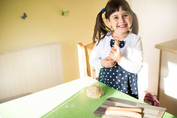 istock Little girl baking at the kitchen 679892994