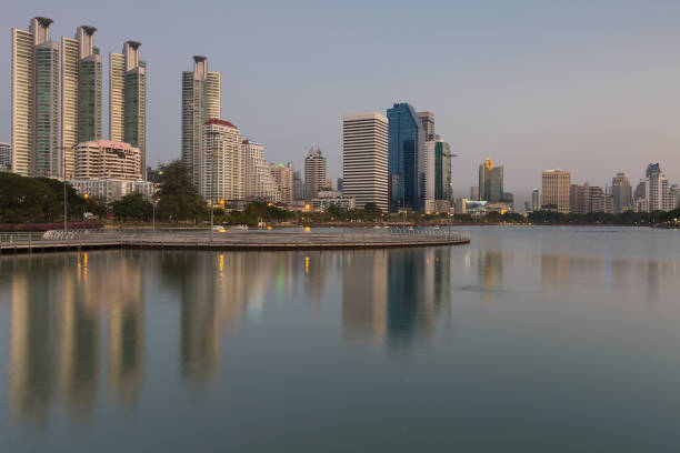 istock Bangkok city office building downtown with water reflection 679894226