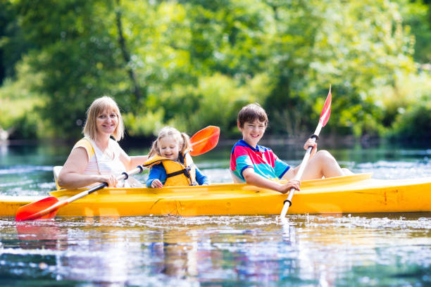 istock Family enjoying kayak ride on a river 679897714