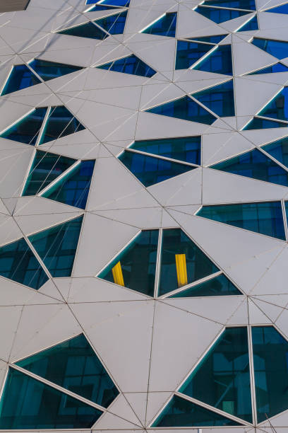 istock Glass and concrete architectural exteriors. Assymetrical windows. 679904606