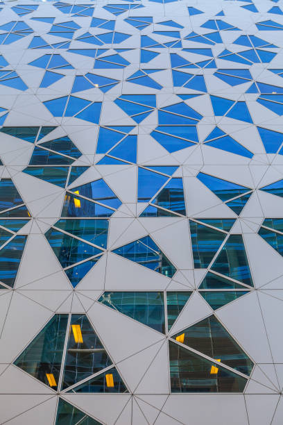 istock Glass and concrete architectural exteriors. Assymetrical windows. 679904770
