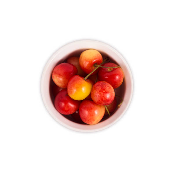 istock bowl with cherries isolated on white background. Ripe cherry close-up. 679904784
