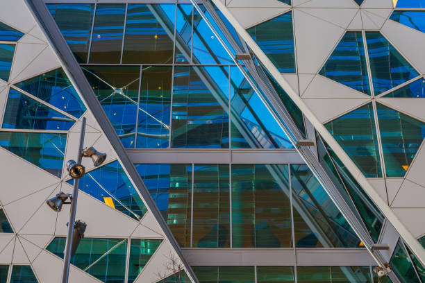 istock Glass and concrete architectural exteriors. Assymetrical windows. 679904812