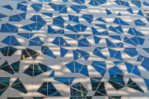 istock Glass and concrete architectural exteriors. Assymetrical windows. 679904958
