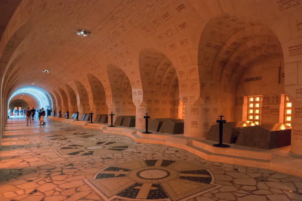 Visitors Douaumont Ossuary,  French WW1 memorial battle of Verdun VERDUN, FRANCE - AUGUST 19, 2016: Visitors in the Douaumont Ossuary, a memorial containing the remains of soldiers died during the Battle of Verdun in First World War One. 1914 stock pictures, royalty-free photos & images