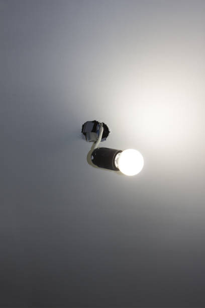 istock The ordinary light bulb on the wire sticks out of the ceiling 679910832