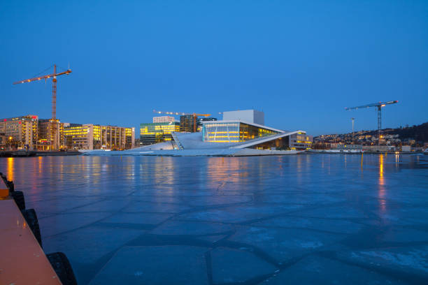 Night view of the Oslo Opera House, frozen bay and new business quarter stock photo