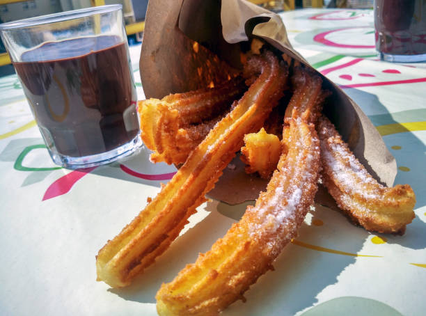 istock Spanish churros with hot chocolate. 679915386