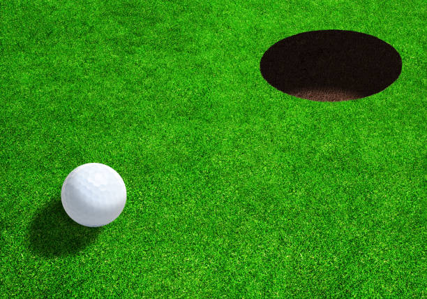 istock Golf Ball Close to Hole With Copy Space 679916450