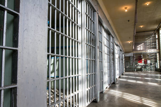 prison bars all locked up - cela imagens e fotografias de stock