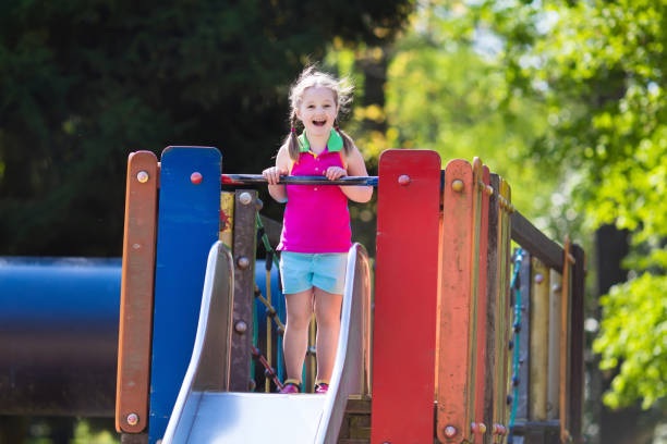 istock Child playing on outdoor playground in summer 679924246