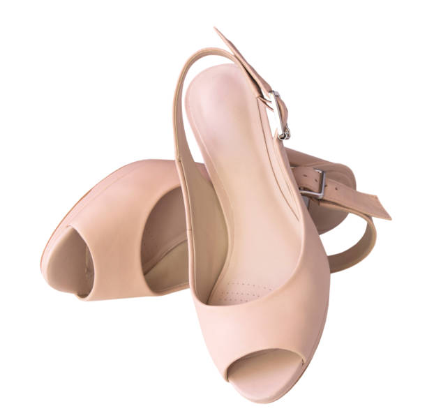 istock Female beige shoes pair isolated. 679927198
