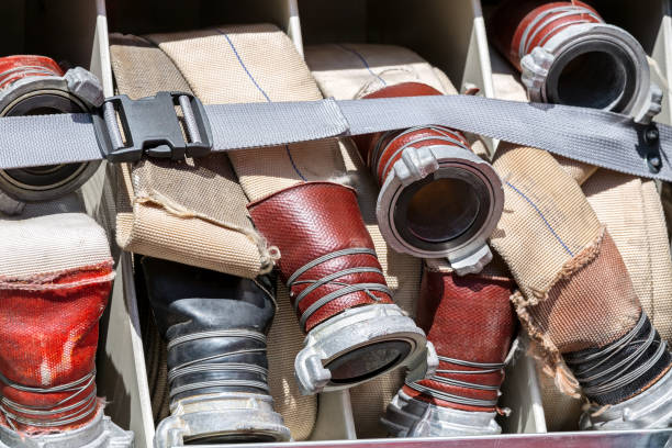 istock line of rolled up hoses on fire truck 679927288