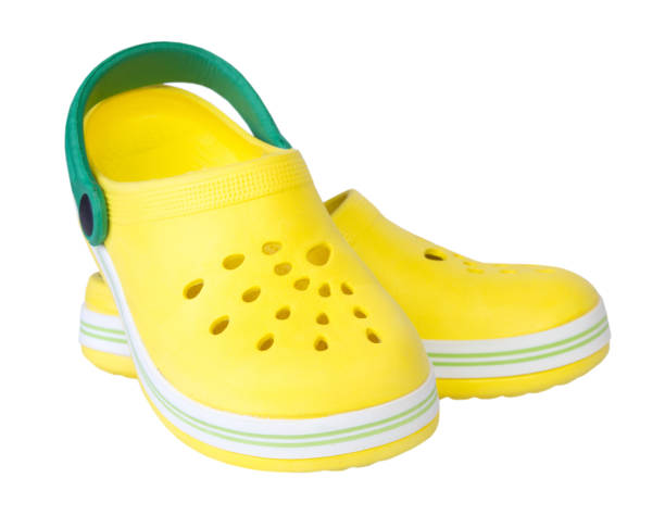 istock Pair yellow rubber kid's shoes isolated. 679930038