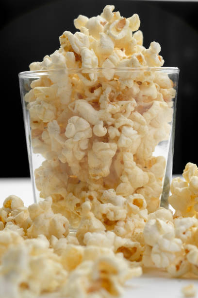 istock Popcorn in the bowl on white background - Soft focus 679936042
