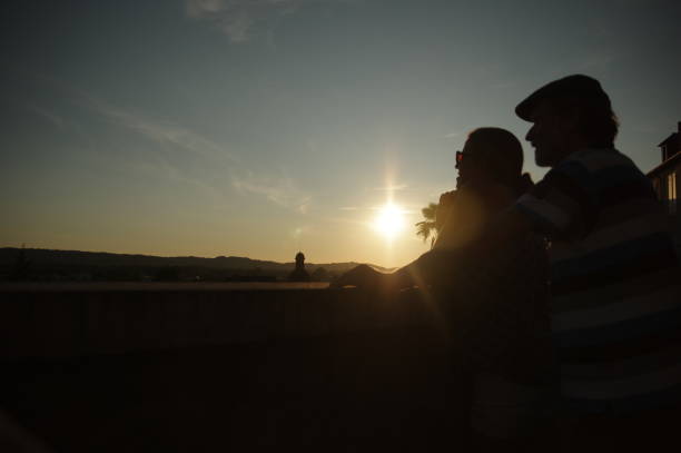 istock Couple is watching the sunset 679938878