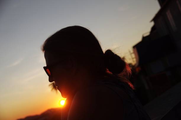 istock Woman is watching the sunset 679938966