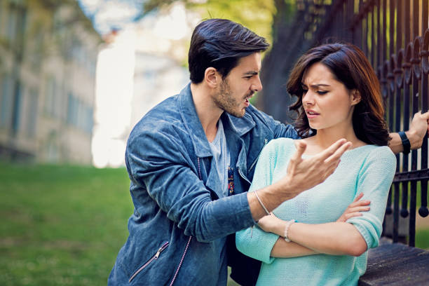Young couple is arguing on the street stock photo