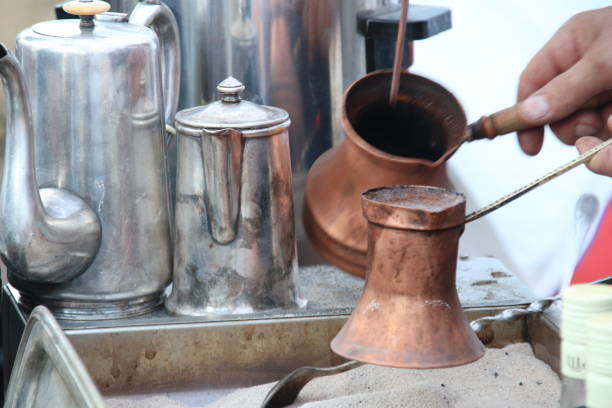 istock traditional turkish coffee being prepared in hot sand 679940860