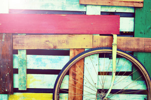 Decorative retro colored wooden cart with a wheel