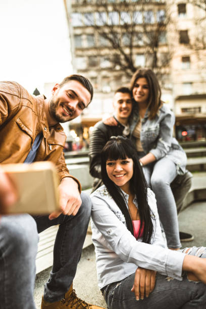 istock group of friends take a selfie togetherness 679954112