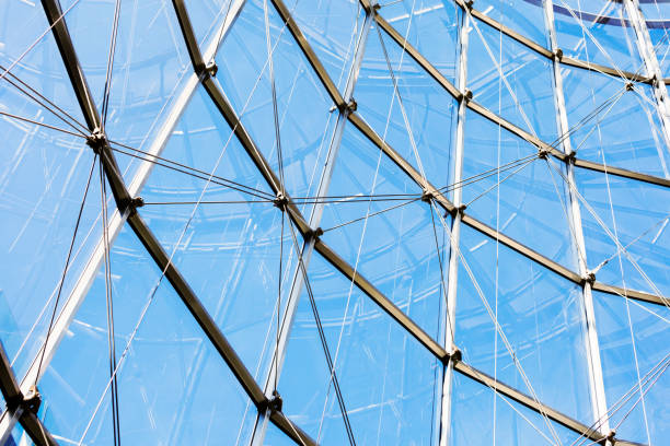 istock Glass wall with metal structure, blue background with copy space 679963520