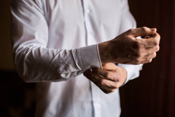 istock men wear a shirt and cufflinks, correct clothes, dressing 679966330