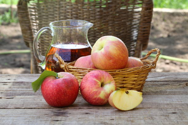 istock red apples on wooden table outdoor 679967700