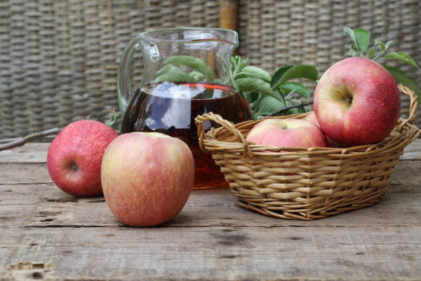 istock red apples on wooden table outdoor 679967752