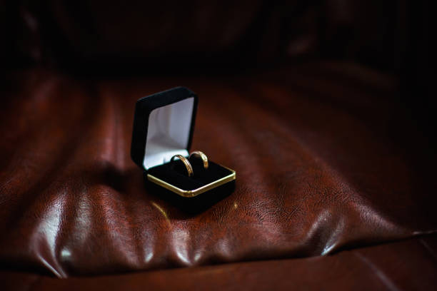 istock Wedding rings in a black box, a box with a wedding ring on a dark background 679967810