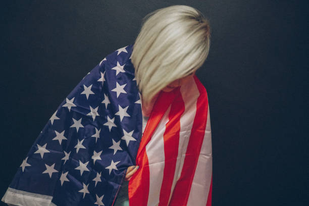 istock Blonde girl with USA flag 679975268