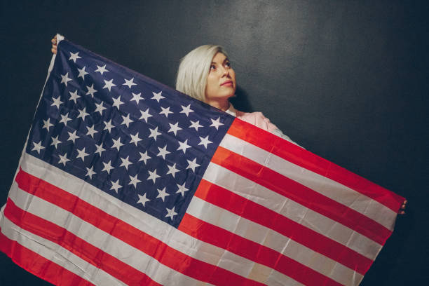 istock Blonde girl with USA flag 679975272