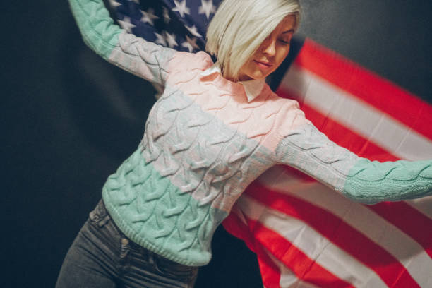 istock Blonde girl with USA flag 679975274