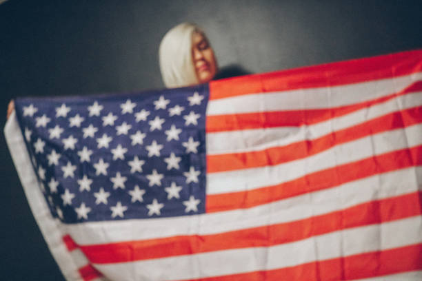 istock Blonde girl with USA flag 679975280