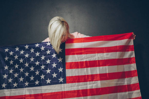 istock Blonde girl with USA flag 679975286