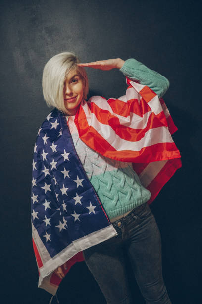 istock Blonde girl with USA flag 679975290