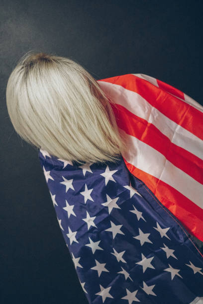 istock Blonde girl with USA flag 679975292