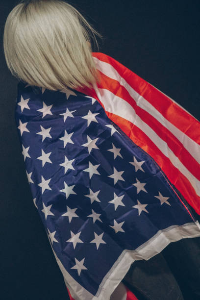istock Blonde girl with USA flag 679975294