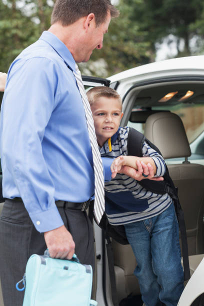 istock Businessman taking boy to school 679975450