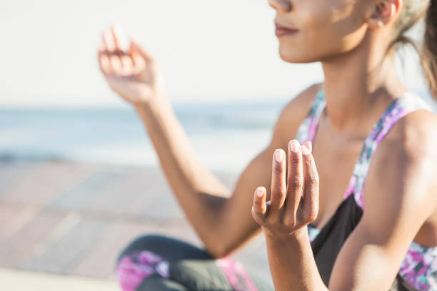 istock Black woman exercising outdoors, doing yoga 679975634