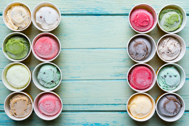 istock Top view Ice cream flavors in cup on wood background 679978714