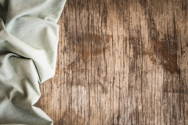 istock Top view of napkin on empty old wooden background 679979134