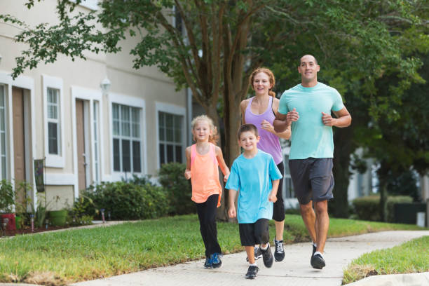 istock Family with two children exercising, running 679980488