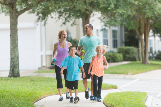 istock Family with two children exercising, walking 679981456