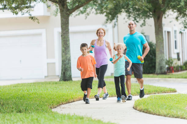 istock Family with two children exercising, walking 679981466