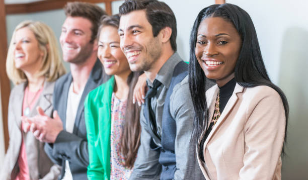 istock Multi-ethnic group of men, women watching presentation 679983778