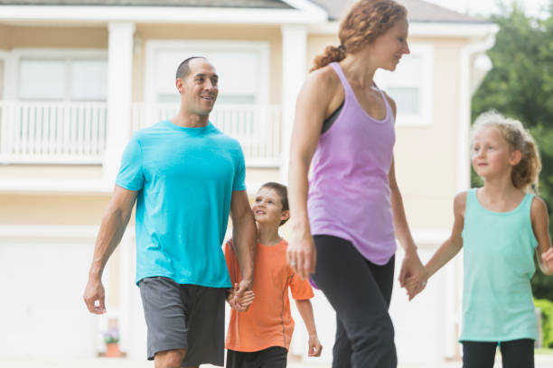istock Family with two children walking 679983842