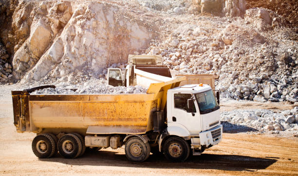 istock Dumper truck driving on a surface mine. quarry 679985426