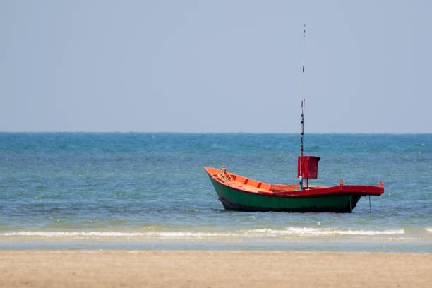 istock Image of small boat sitting on the beach. 679990600